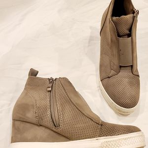 Unsure tan wedge sneakers
